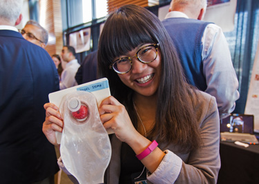 Student holding stoma device