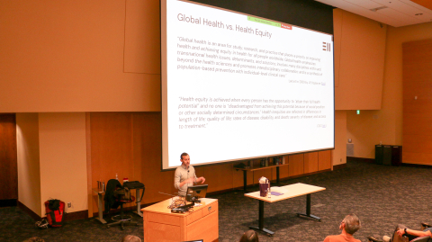 Boston Nyer on stage at the University of Washington's lecture hall