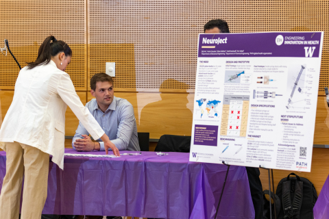 Members of the Neuroject Team prepare for the poster session of the annual EIH Spring Symposium.