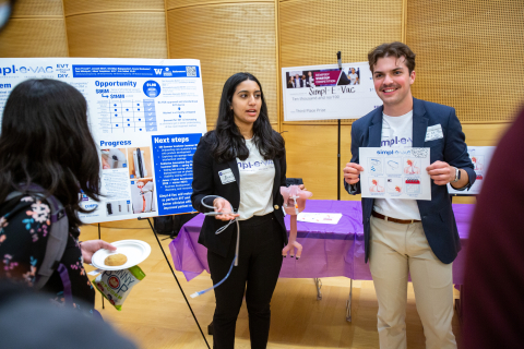 Members of team Simpl-e-vac present their prototype at the annual EIH Spring Symposium.