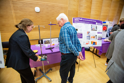 A member of the WiOTech team demonstrates one of the many prototypes created over the year.