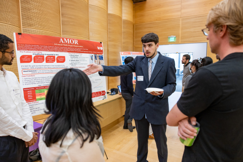 Members of team AMOR present their project at the annual EIH Spring Symposium